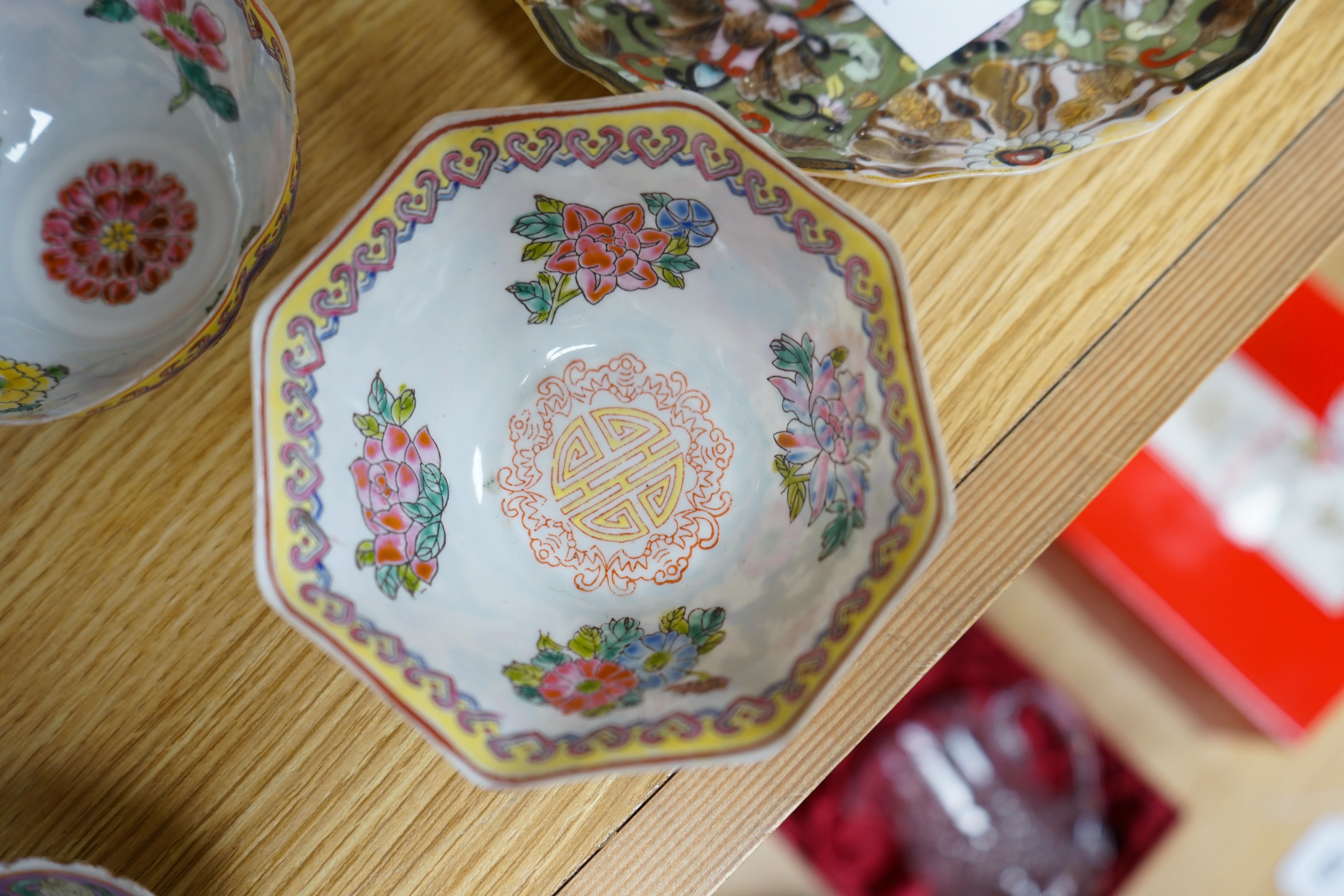 A quantity of Chinese and Japanese porcelain to include blue and white bowls, famille rose tea bowls and a pair of late 19th century dishes (18). Condition - varies, poor to fair